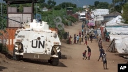 FILE - A U.N. armored personnel vehicle stops in a refugee camp in Juba South Sudan, July 25, 2016.