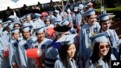 Students participate in a graduation ceremony at Columbia University in New York, May 17, 2017. 