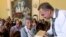 Lviv Mayor Andriy Sadoviy, right, presents a glass copy of an old metal synagogue key to Yanina Hescheles, Polish writer and a Nazi concentration camp survivor, at a ceremony commemorating the 75th anniversary of the annihilation of the city's Jewish population by Nazi Germany in Lviv, Ukraine, Sunday, Sept. 2, 2018. 
