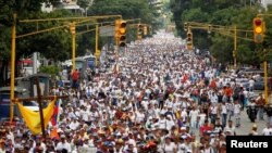 Demonstrators take part in a rally to honor victims of violence during a protest against Venezuela's President Nicolas Maduro's government in Caracas, Venezuela, April 22, 2017. 