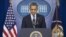 President Barack Obama pauses as he talks about the Connecticut elementary school shooting, in the White House briefing room in Washington, December 14, 2012.