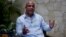 Former Haitian Prime Minister Laurent Lamothe speaks during an interview with Associated Press in Port-au-Prince, Dec. 15, 2014. 