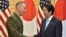 General Joseph Dunford, left, the chairman of the U.S. Joint Chiefs of Staff, shakes hands with Japan's Prime Minister Shinzo Abe at Abe's official residence in Tokyo, Japan, Aug. 18, 2017.