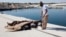 A man inspects the bodies of three African migrants that were recovered by the Libyan coastguard after their boat sunk off the coastal town of Garaboly, east of Tripoli, Sept. 15, 2014.