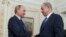 Russian President Vladimir Putin shakes hands with Israeli Prime Minister Benjamin Netanyahu, right, during their meeting at the Novo-Ogaryovo residence, outside Moscow, Sept. 21, 2015. 