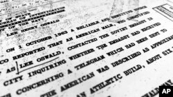 Part of a file from the CIA, dated Oct. 10, 1963, details "a reliable and sensitive source in Mexico" report of Lee Harvey Oswald's contact with the Soviet Union embassy in Mexico City, that was released for the first time on Friday, Nov. 3, 2017, by the National Archives. Documents show U.S. officials scrambling after the assassination of President John F. Kennedy to round up information about Lee Harvey Oswald's trip to Mexico City weeks earlier.