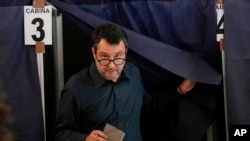 FILE - The League party leader Matteo Salvini leaves the voting booth before casting his ballot at a polling station in Milan, June 8, 2024. 