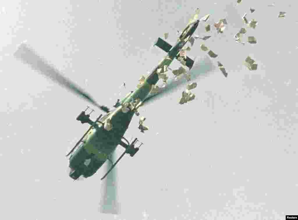 A military helicopter drops leaflets above Tiananmen Square, May 22, 1989.