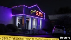 Crime scene tape surrounds Gold Spa after deadly shootings at a massage parlor and two day spas in the Atlanta area, in Atlanta, Georgia, March 16, 2021. 