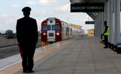 FILE - A train launched to operate on the Standard Gauge Railway line constructed by the China Road and Bridge Corporation and financed by Chinese government arrives at the Nairobi Terminus on the outskirts of Nairobi, Kenya, May 31, 2017.