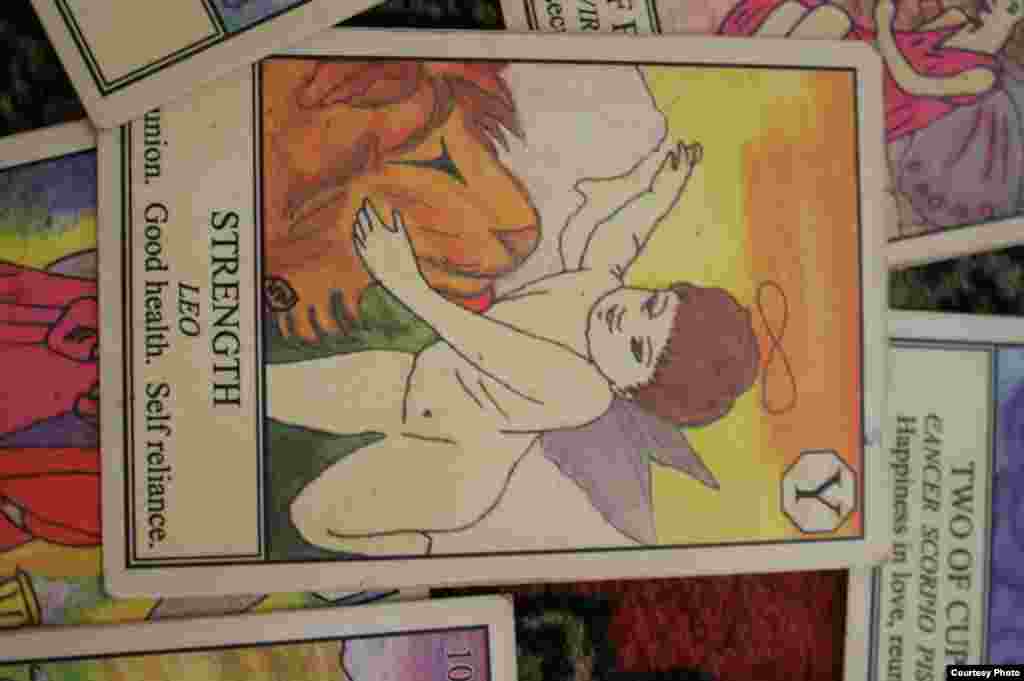 Her card of ‘Strength’ shows another cherub stroking the mane of a lion promising “Good Health” and “Self-Reliance.” (Photo by Darren Taylor)