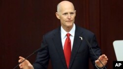 FILE - Gov. Rick Scott speaks to the Legislature, March 7, 2017, in Tallahassee, Fla.