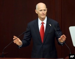 Gov. Rick Scott speaks to the Legislature, March 7, 2017, in Tallahassee, Fla. Scott reassigned a case when State Attorney Aramis Ayala said she would no longer seek the death penalty.