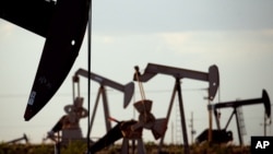 FILE - Pumpjacks work in a field near Lovington, New Mexico, on April 24, 2015. The U.S. Environmental Protection Agency said on Dec. 2, 2023, that a new rule will reduce methane emissions generated by the oil and gas industry.