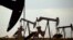 FILE - Pumpjacks work in a field near Lovington, New Mexico, on April 24, 2015. The U.S. Environmental Protection Agency said on Dec. 2, 2023, that a new rule will reduce methane emissions generated by the oil and gas industry.
