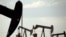 FILE - Pumpjacks are seen in a field near Lovington, New Mexico, April 24, 2015. The U.S. Environmental Protection Agency is expected to roll back requirements on detecting and plugging methane leaks at oil and gas facilities.