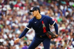 American League starting pitcher Shohei Ohtani of the Los Angeles Angels (17) pitches against the National League during the first inning of the 2021 MLB All Star Game at Coors Field. (Mandatory Credit: Mark J. Rebilas-USA TODAY Sports)