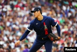 American League starting pitcher Shohei Ohtani of the Los Angeles Angels (17) pitches against the National League during the first inning of the 2021 MLB All Star Game at Coors Field. (Mandatory Credit: Mark J. Rebilas-USA TODAY Sports)