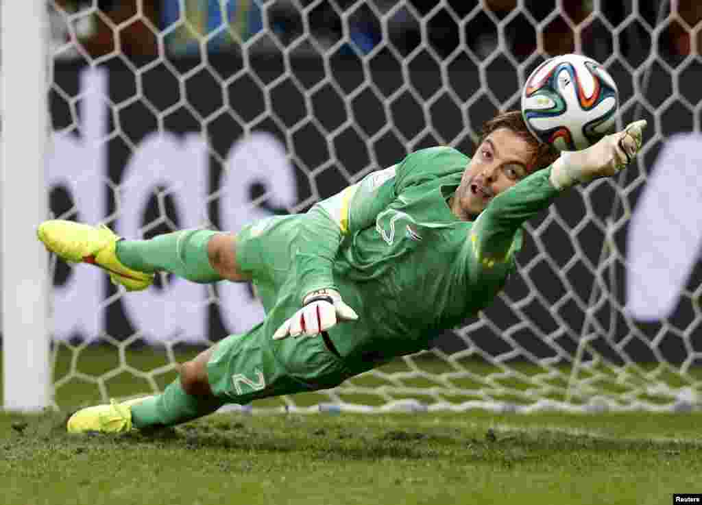 Goalkeeper Tim Krul of the Netherlands saves the last penalty shot against Costa Rica during a penalty shootout in their quarter-finals at the Fonte Nova arena in Salvador, July 5, 2014.