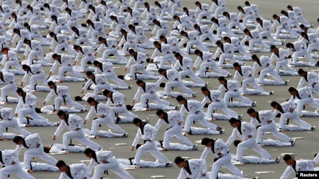 FILE - Members of the Special Warfare Command demonstrate the traditional Korean martial art of taekwondo during celebrations to mark the 65th anniversary of Korea Armed Forces Day, Seongnam, Oct. 1, 2013. 