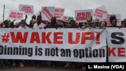 Protesters march in the streets of Malawi's capital, Lilongwe, over continued attacks on albinos.