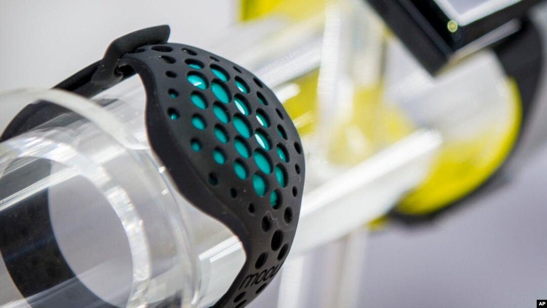 FILE - A wearable fitness device from Moov offers high-tech ways of getting in shape.