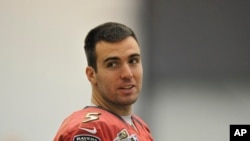 Baltimore Ravens quarterback Joe Flacco looks towards the media during football practice, Jan. 26, 2013 in Owings Mills, Md.