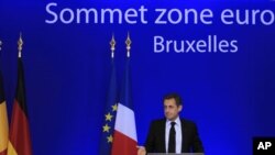 France's President Nicolas Sarkozy holds a news conference at the end of a Euro zone summit in Brussels, October 27, 2011.