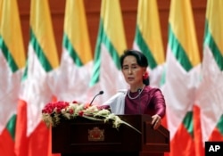 Myanmar's State Counsellor and de facto leader Aung San Suu Kyi delivers a televised speech to the nation at the Myanmar International Convention Center in Naypyitaw, Myanmar, Sept. 19, 2017.