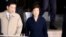 South Korea's ousted leader Park Geun-hye, right, leaves a prosecutor's office in Seoul, March 22, 2017. 