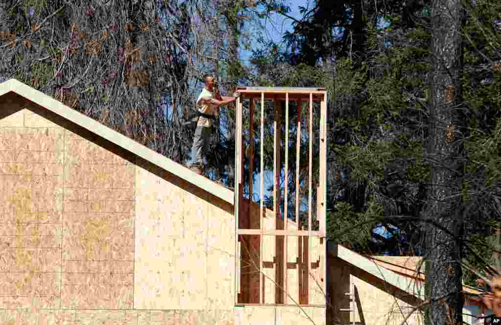A home is rebuilt, Oct. 18, 2019, after the last year's Camp Fire in Paradise, Calif., Only a handful of homes have been rebuilt in the community that lost nearly 9,000 residences in last year's Camp Fire.