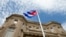 FILE - The Cuban flag is raised over their new embassy in Washington.