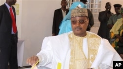 Presidential candidate Seini Oumarou, a former prime minister under deposed president Mamadou Tandja, casts his vote in Niamey, Niger, Monday, Jan. 31, 2011. This impoverished country on the edge of the Sahara took another stab at democracy Monday when it