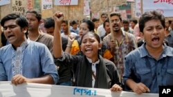 Bangladeshi youth shout slogans as they protest the killing of Faisal Arefin Deepan, a publisher of secular books, in Dhaka, Bangladesh, Nov. 1, 2015.