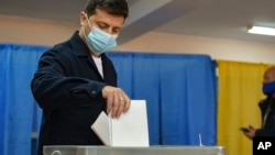 FILE - Ukrainian President Volodymyr Zelenskyy casts his ballot in a local election in Kyiv on Oct. 25, 2020. Zelenskyy was elected in 2019, with the next presidential election scheduled for 2024, but martial law has been in effect since Russia invaded in 2022.