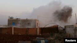 Smoke rises after what activists said were clashes with Islamic State fighters in Soran Azaz, Aleppo, Syria. June 1, 2015.