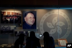 FILE - A portrait of former Chinese leader Deng Xiaoping is displayed at the exhibition "Hong Kong history" at the Hong Kong Museum of History on October 16, 2020.