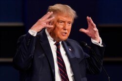 President Donald Trump gestures while speaking during the first presidential debate Tuesday, Sept. 29, 2020, at Case Western University and Cleveland Clinic, in Cleveland, Ohio.