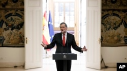 Spain's Prime Minister Mariano Rajoy gestures during a traditional press conference at the end of the year held at the Moncloa Palace in Madrid, Spain, Friday, Dec. 30, 2016 .