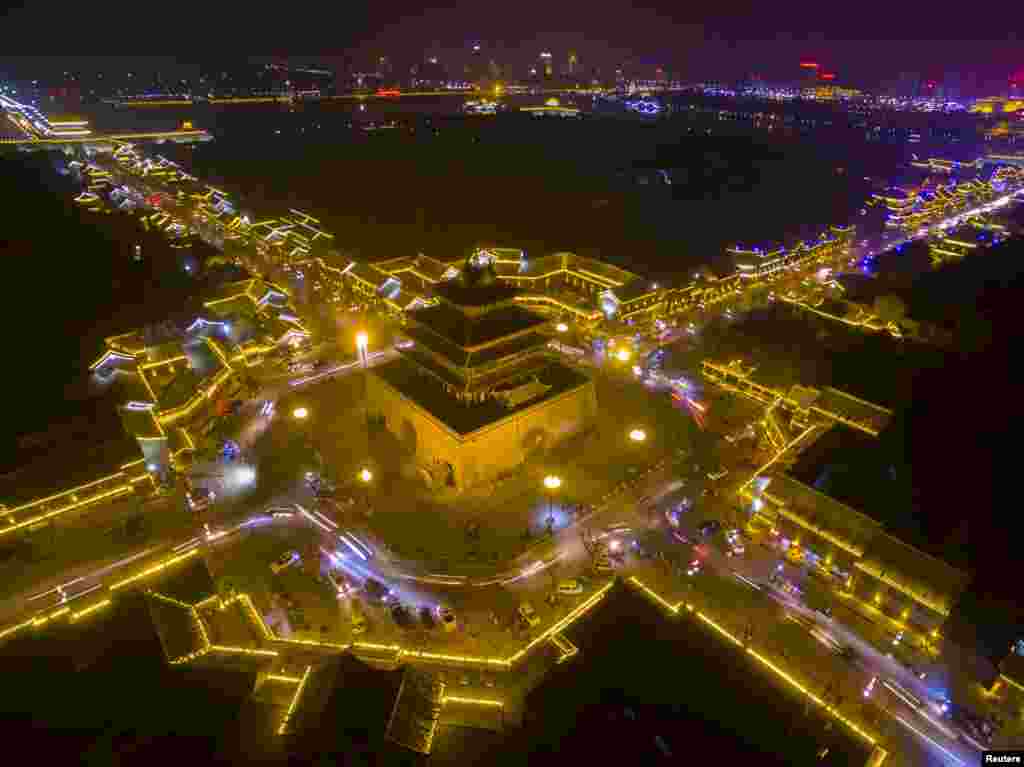 Traditional buildings are seen lit up at night in Liaocheng, Shandong province, China, Feb. 10, 2016.