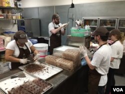 A team of workers make hand-crafted caramels in small batches at the Chouquette kitchen just outside Washington. (VOA Photo/J.Taboh)