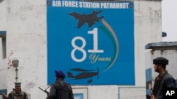 FILE - Indian soldiers stand guard outside an air base in Pathankot, India, Jan. 4, 2016. 