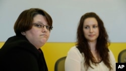 Angela Arellano, left, formerly of the U.S. Marines, and Nichole Bowen, formerly of the U.S. Army, talk about of sexual assault in the military on May 31, 2013 in Seattle. Both women identified themselves as being survivors of sexual assault during their time in military service.