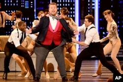 Host James Corden, center, performs at the 73rd annual Tony Awards at Radio City Music Hall on Sunday, June 9, 2019, in New York.
