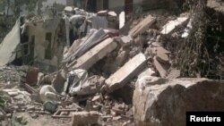 A collapsed house is seen after two earthquakes in Zhaotong, Yunnan province, September 7, 2012.