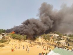 A fire is seen at a Balukhali refugee camp in Cox's Bazar, Bangladesh, March 22, 2021, in this picture obtained from social media. (Rohingya Right Team/Md Arakani/via Reuters)