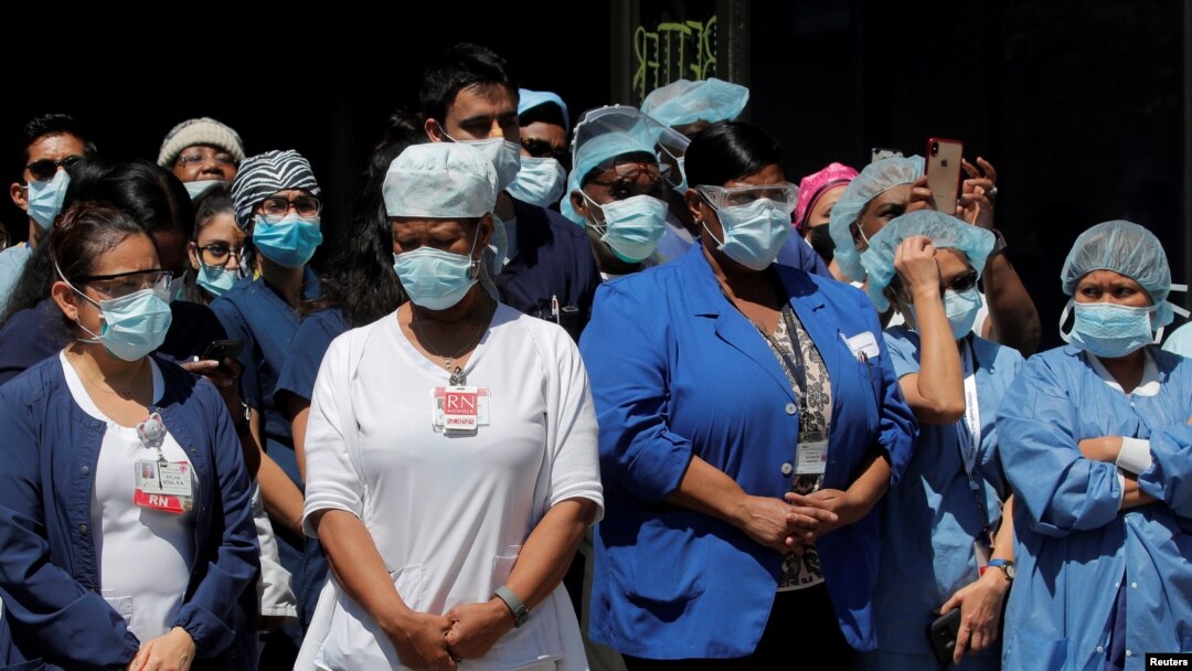 Health care workers gather for lunch purchased by members of the New York City Police Department (NYPD) outside the Brooklyn Hospital Center, during the outbreak of coronavirus disease (COVID-19) in the Brooklyn borough of New York City, April 28, 2020.