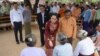 Myanmar's State Counsellor Aung San Suu Kyi talks to the elderly at a peace talk conference in May Tain Kan village, Wundwin, in Mandalay Division, Aug. 7, 2017. 