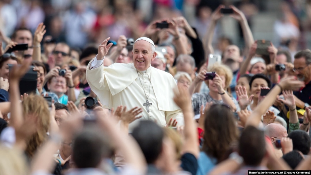 Pope Francis greets supporters on Aug. 8, 2014.