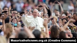 Pope Francis greets supporters on Aug. 8, 2014.